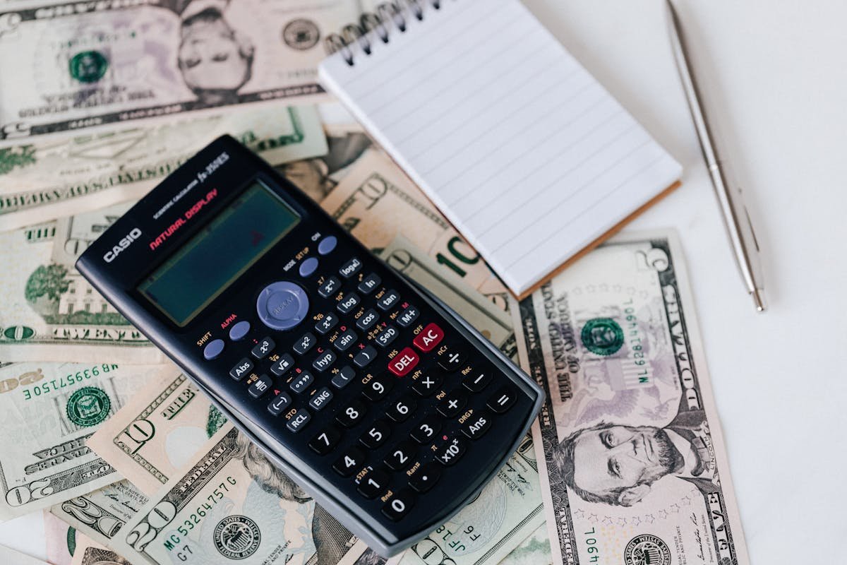 Person reviewing bills and digital payments on a phone