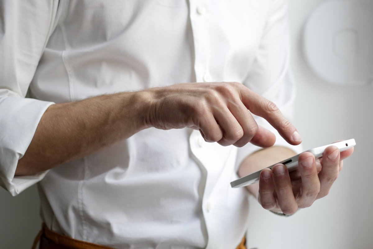 Person using a smartphone to manage text messages