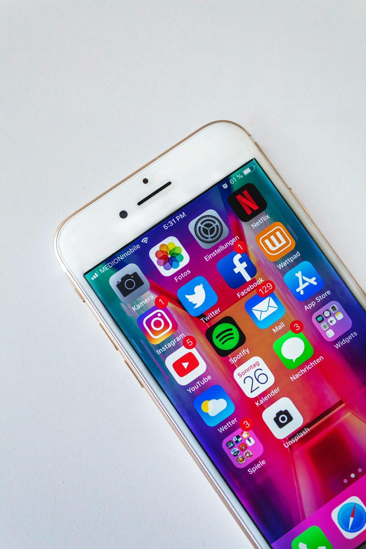 Person holding a phone while reviewing chat and app settings