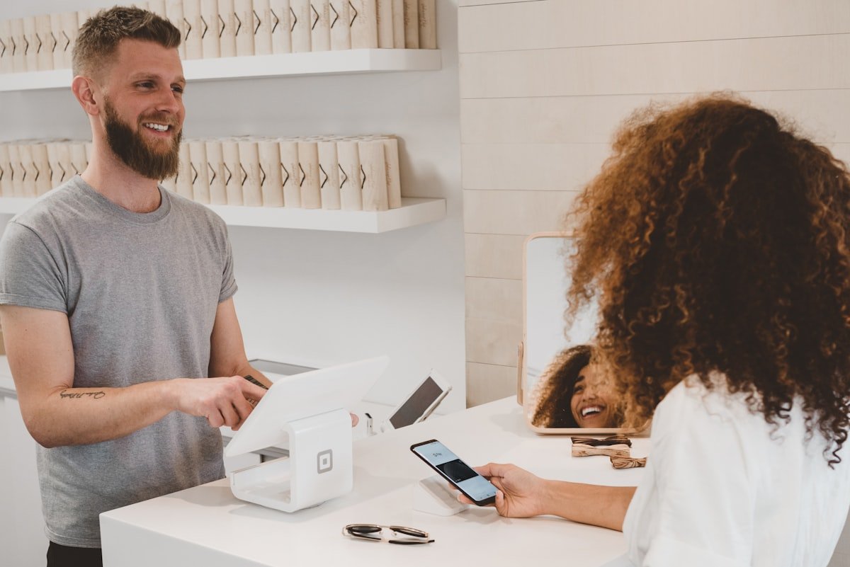Person shopping online from a laptop with a payment card nearby